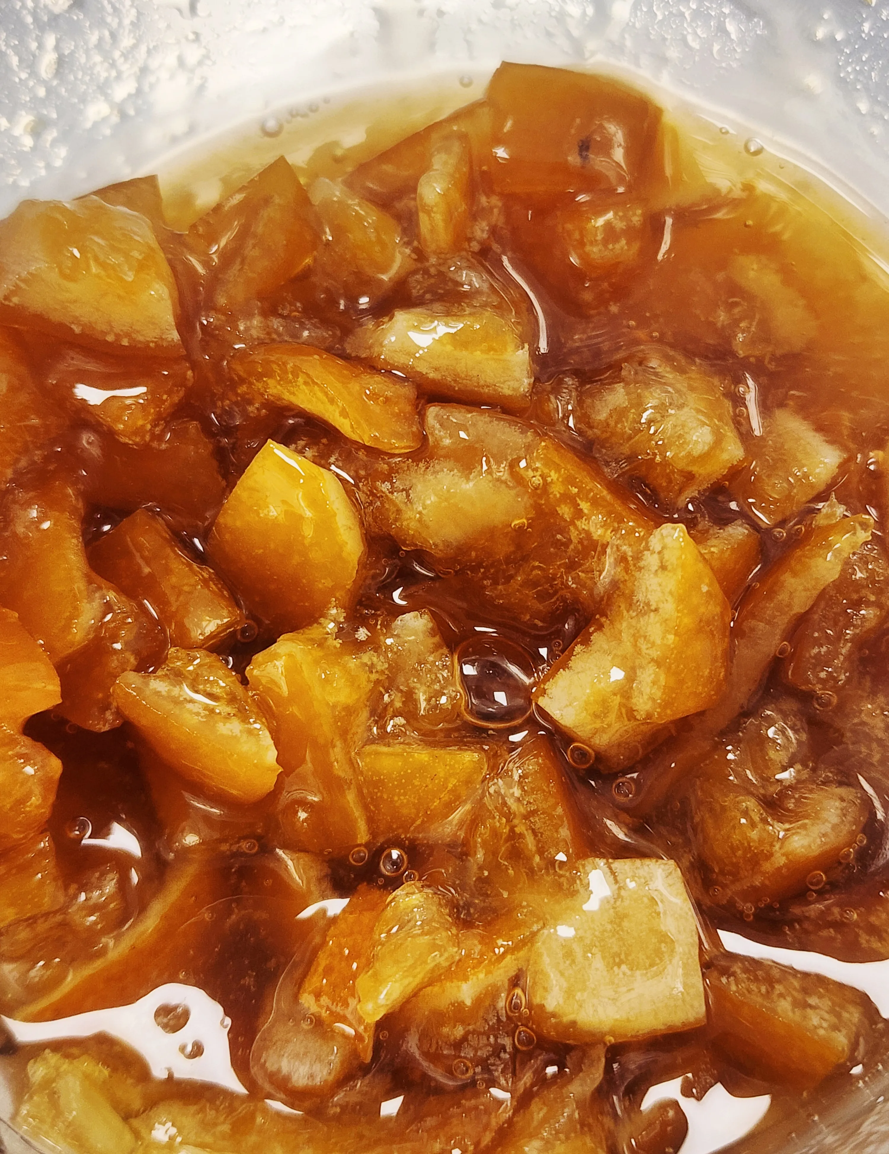 Hand-candied lemon pieces in glossy amber syrup, prepared in the Alchemy Bakery kitchen